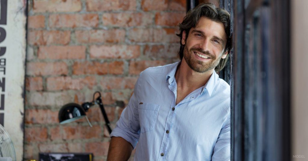 Handsome man with dark hair smiling at the camera (MODEL)